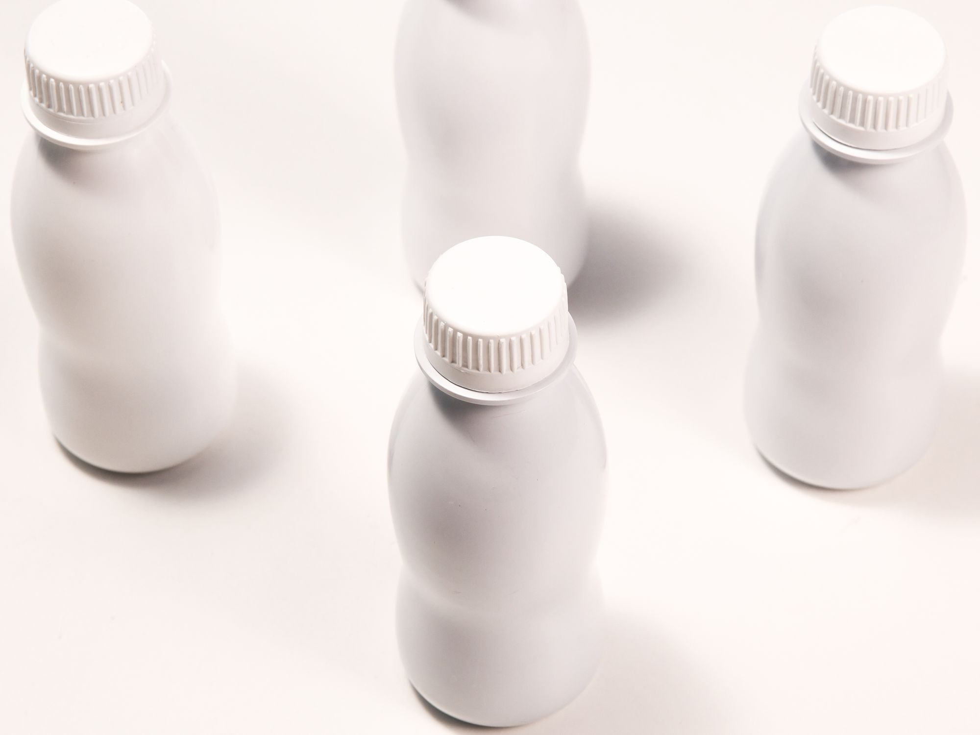 White light-blocking dairy bottles